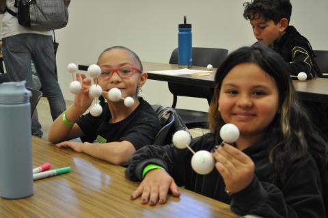 STEM Girl Day participants with molecule creations